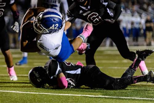 Trent Nelson  |  The Salt Lake Tribune
Bingham's Parker Taufa dives into the end zone for a touchdown as Jordan hosts Bingham High School football in Sandy, Wednesday October 14, 2015.