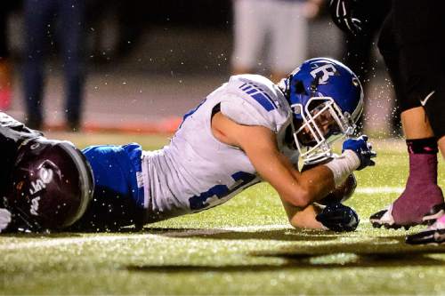 Trent Nelson  |  The Salt Lake Tribune
Bingham's Brady Atkin dives into the end zone as Jordan hosts Bingham High School football in Sandy, Wednesday October 14, 2015.