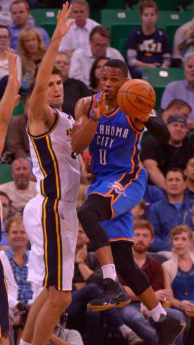 Leah Hogsten  |  The Salt Lake Tribune
Oklahoma City Thunder guard Russell Westbrook (0) slips past Utah Jazz center Jeff Withey (24). Oklahoma City Thunder lead the Utah Jazz  57-43 at the half, Tuesday, October 20, 2015 at Energy Solutions Arena.