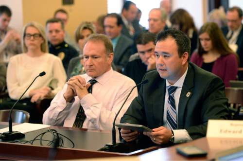 Al Hartmann  |  The Salt Lake Tribune
Senator Mark Madsen, R-Saratoga Springs listens to discussion on medical marijuana legislation before the 
Health and Human Services Interim Committee Wednesday Oct. 21 at the Utah State Capitol.  Right, Pete Haglin of Park City a former paratrooper in the Army 82nd Airborn speaks candidly to the committee about his beneficial use of marijuana while in Colorado to help him sleep, and deal with PTSD.