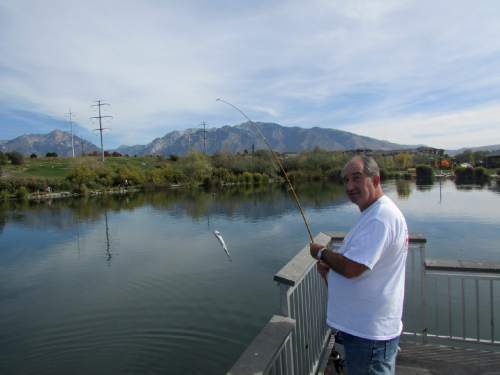 Tom Wharton  |  The Salt Lake Tribune

Mont Rouska of Kearns catches a trout at Sandy fishing pond.
