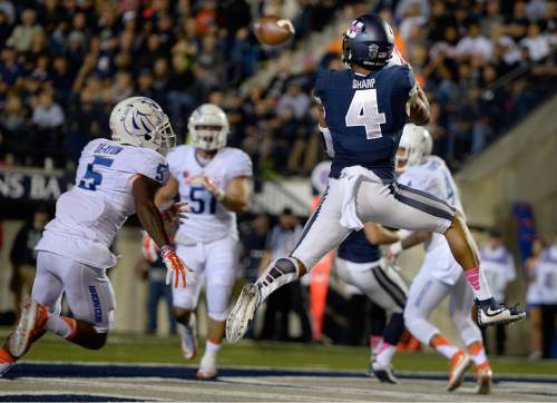 Utah State wide receiver Hunter Sharp (4) catches a touchdown pass against Boise State during the first quarter of an NCAA college football game Friday, Oct. 16, 2015, in Logan, Utah. (Scott Sommerdorf/The Salt Lake Tribune via AP) DESERET NEWS OUT; LOCAL TELEVISION OUT; MAGS OUT; MANDATORY CREDIT