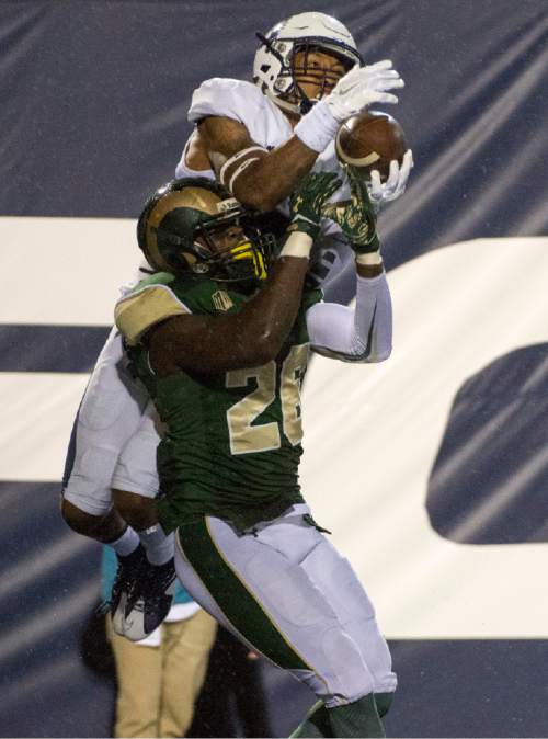 Rick Egan  |  The Salt Lake Tribune

Utah State Aggies wide receiver Hunter Sharp (4) leaps in high into the air to grab a pass, as  Colorado State Rams defensive back Kevin Pierre-Louis (26) defends. The play was ruled incomplete, because Sharp was out of the end zone, in college football action, Utah State vs Colorado State at Maverik Stadium in Logan, Saturday, October 3, 2015.