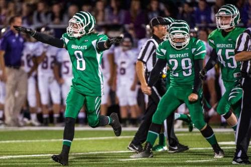 Chris Detrick  |  The Salt Lake Tribune
South Summit's Matt Lee (8) celebrates after making an interception on the first play of the game during the game at South Summit High School Thursday October 15, 2015.