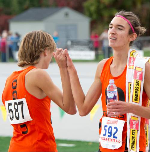 Rick Egan  |  The Salt Lake Tribune

Garrett Barton (587), Ogden High, congratulates team mate Alek Parsons (592) Ogden High,  on his first place finish, in the Boys 4A cross country state championship race at Sugarhouse Park, Wednesday, October 21, 2015.