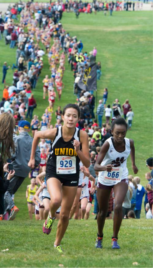 Rick Egan  |  The Salt Lake Tribune

Kennedy Powell, Union High and Meskerem Stucki, Pine View High, lead the race as they make their way up the first steep hill, in the Girls 3A cross country state championship race at Sugarhouse Park, Wednesday, October 21, 2015.