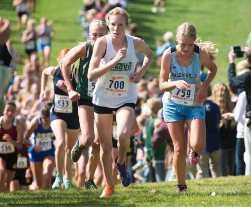 Rick Egan  |  The Salt Lake Tribune

Kate Hunter, Provo High, and Haley Johnston, Salem Hills, lead the group, as they climb the hill in the Girls 4A cross country state championship race at Sugarhouse Park, Wednesday, October 21, 2015. Hunter remained in the lead for a first place finish in the race