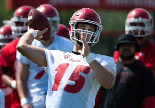Steve Griffin  |  The Salt Lake Tribune

University of Utah quarterback Chase Hansen throws a pass during first day of fall football camp at the University of Utah baseball field in Salt Lake City, Thursday, August 6, 2015.  l