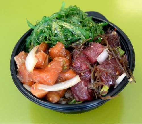 Al Hartmann  |  The Salt Lake Tribune
Poke bowl of Shoyu Salmon, Limu Ahi, and Seaweed Salad at the Laid Back Poke Shack at 6213 E. Highland Drive in Holladay. Laid Back Poke Shack offers fresh fish and plenty of Hawaiian mahalo in their poke bowls available in nearly a dozen flavors each day.