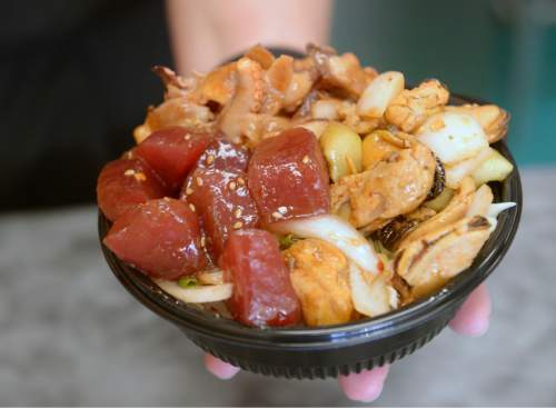 Al Hartmann  |  The Salt Lake Tribune
Poke bowls are made up on the spot by owner Deanna Zouras at the Laid Back Poke Shack at 6213 E. Highland Drive in Holladay. Pictured, a Poke Bowl with Shoyu Ahi Tuna, Kimchi Mussells and Kimchi Tako.