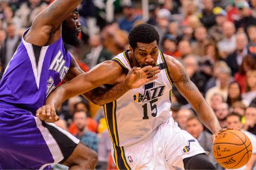 Trent Nelson  |  The Salt Lake Tribune
Utah Jazz forward Derrick Favors (15) drives on Sacramento Kings center Reggie Evans (30), as the Utah Jazz host the Sacramento Kings at EnergySolutions Arena in Salt Lake City, Wednesday April 8, 2015.