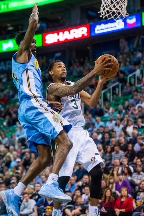 Chris Detrick  |  The Salt Lake Tribune
Denver Nuggets guard Will Barton (5) blocks Utah Jazz guard Trey Burke (3) during the game at EnergySolutions Arena Thursday October 22, 2015.