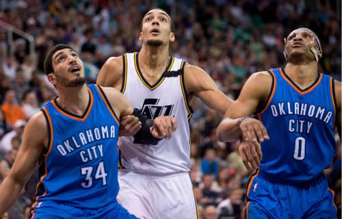 Lennie Mahler  |  The Salt Lake Tribune

Enes Kanter, Rudy Gobert and Russell Westbrook battle for a rebound in the first half of a game between the Utah Jazz and Oklahoma City Thunder at EnergySolutions Arena on Saturday, March 28, 2015.