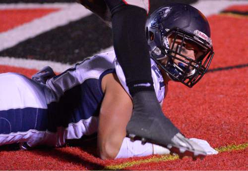 Leah Hogsten  |  The Salt Lake Tribune
Corner Canyon's Ryan Hanson on his touchdown run. 
Alta High School football team leads Corner Canyon High School 31-24, Friday, October 23, 2015 at Alta.