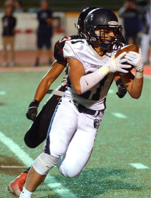 Leah Hogsten  |  The Salt Lake Tribune
Corner Canyon's Ryan Hanson on his touchdown run. 
Alta High School football team leads Corner Canyon High School 31-24, Friday, October 23, 2015 at Alta.