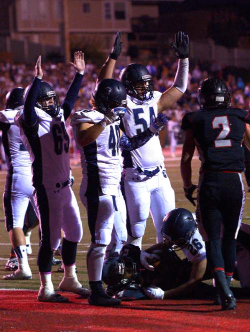 Leah Hogsten  |  The Salt Lake Tribune
Corner Canyon celebrates Jason Adams' touchdown. 
Alta High School football team leads Corner Canyon High School 31-24, Friday, October 23, 2015 at Alta.