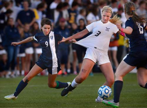 Scott Sommerdorf   |  The Salt Lake Tribune
Timpanogos' Tess Donaldson has a handful of Skyline's Madelyn Gill as they battle for the ball during second half play. Skyline beat Timpanogos 3-1 for the girl's 4A soccer title 3-1 played at Rio Tinto stadium, Friday, October 23, 2015.
