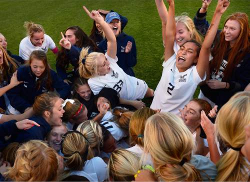 Scott Sommerdorf   |  The Salt Lake Tribune
Skyline's Alletse Soto, (2), and Claire Dunford, (33), celebrate on the edges of the pile of players after Skyline beat Timpanogos 3-1 for the girl's 4A soccer title 3-1 played at Rio Tinto stadium, Friday, October 23, 2015.