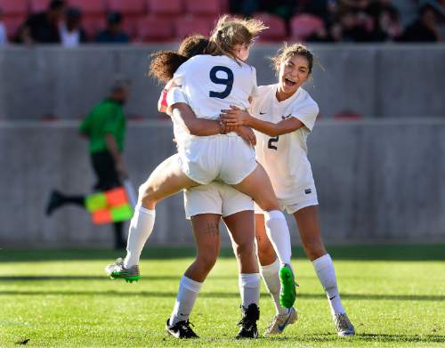 Scott Sommerdorf   |  The Salt Lake Tribune
Skyline's Holly Daugirda, (9), jumps into the arms of team mate Bergen Meyer as Alletse Soto, (2), runs in at right after Daugirda scored Skyline's third goal late in the second half. Skyline beat Timpanogos 3-1 for the girl's 4A soccer title 3-1 played at Rio Tinto stadium, Friday, October 23, 2015.