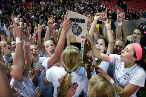 Scott Sommerdorf   |  The Salt Lake Tribune
Davis players celebrate as others rush in to grab a piece of the trophy after Davis beat Weber 1-0 for the girl's 5A title at Rio Tinto stadium, Friday, October 23, 2015.