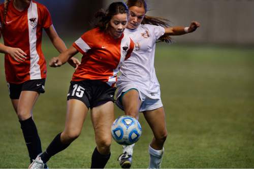 Scott Sommerdorf   |  The Salt Lake Tribune
Weber's Mylee Broad, left, and Davis' Ellie Robinson battle during second half play. Davis beat Weber 1-0 for the girl's 5A title at Rio Tinto stadium, Friday, October 23, 2015.