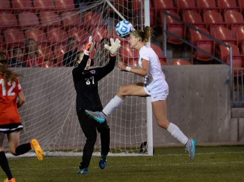 Scott Sommerdorf   |  The Salt Lake Tribune
Weber goalkeeper Hannah Johnson makes this save as Davis' Olivia Wade flashes by with a header during second half play. Davis beat Weber 1-0 for the girl's 5A title at Rio Tinto stadium, Friday, October 23, 2015.