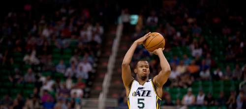 Lennie Mahler  |  The Salt Lake Tribune

Rodney Hood fires a three-pointer in the first half as the Utah Jazz faced the Dallas Mavericks at EnergySolutions Arena on Monday, April 13, 2015.