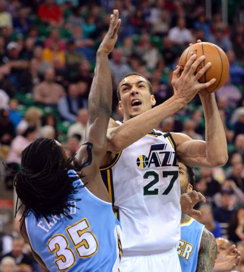 Steve Griffin  |  The Salt Lake Tribune

Utah Jazz center Rudy Gobert (27) spins past Denver Nuggets forward Kenneth Faried (35) during first half action in the Jazz versus Nuggets NBA game at EnergySolutions Arena in Salt Lake City, Wednesday, April 1, 2015.