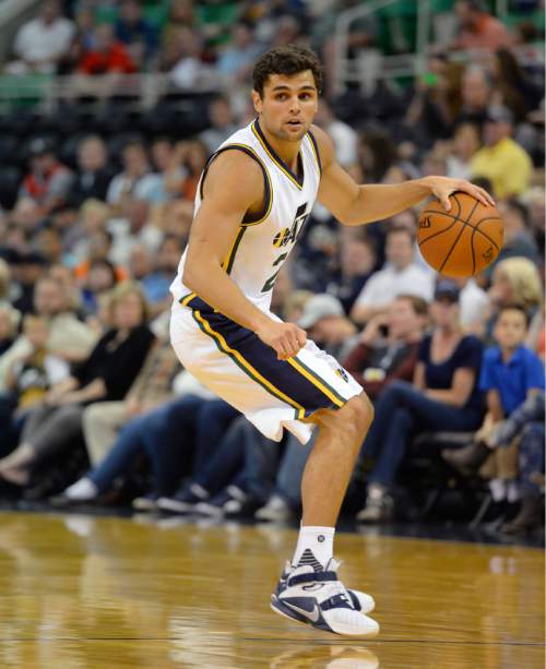 Steve Griffin  |  The Salt Lake Tribune

Utah Jazz guard Raul Neto (25) brings the ball up court during the Utah Jazz versus the Portland Trailblazers preseason NBA basketball game at EnergySolutions Arena in Salt Lake City, Monday, October 12, 2015.