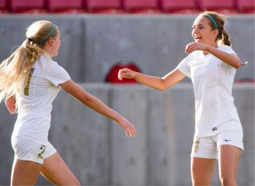 Rick Egan  |  The Salt Lake Tribune

The Logan Grizzlies Kaycee Larsen (21) and Kennedy Michel (34) celebrate after Michel's scored a goal, making the score 2-0 for Logan, in their 3-1 win over the Cedar Redmen, in the 3A girls soccer state title game at Rio Tinto Stadium, Saturday, October 24, 2015.