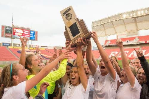 Rick Egan  |  The Salt Lake Tribune

The Logan Grizzlies celebrate their 3-1 win over the Cedar Redmen, in the 3A girls soccer state title game at Rio Tinto Stadium, Saturday, October 24, 2015.