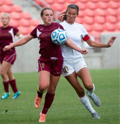 Rick Egan  |  The Salt Lake Tribune

Cedar Redmen's Whitney Yardley (8) goes for the ball, along with Logan Grizzlies Demi Lopez (10), in the 3A girls soccer state title game at Rio Tinto Stadium, Saturday, October 24, 2015.