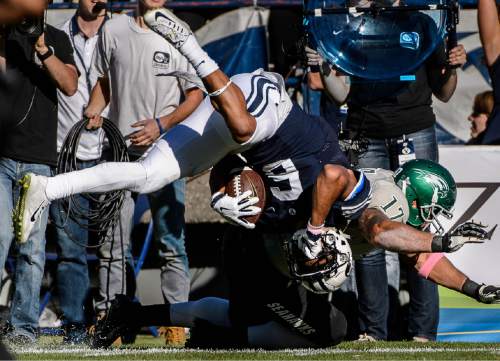 Trent Nelson  |  The Salt Lake Tribune
Wagner Seahawks linebacker Nick Menocal (17) brings down Brigham Young Cougars wide receiver Trey Dye (6) as BYU hosts Wagner, NCAA football at LaVell Edwards Stadium in Provo, Saturday October 24, 2015.
