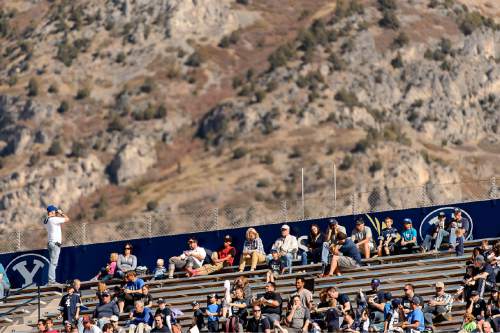 Trent Nelson  |  The Salt Lake Tribune
A BYU fan finds the scenery outside the stadium of more interest as BYU leads Wagner 49-0 in the first half, NCAA football at LaVell Edwards Stadium in Provo, Saturday October 24, 2015.