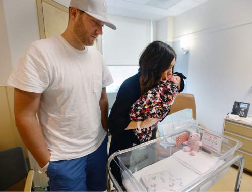 Steve Griffin  |  The Salt Lake Tribune


Korey and Makenzie Marsh, of Herriman, with their 3-day-old daughter, Bayne, at the Women's and Newborn Center at the Intermountain Medical Center in Murray, Tuesday, July 7, 2015.