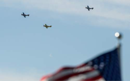 Francisco Kjolseth | The Salt Lake Tribune
Brig. Gen. Roland Wright, who piloted the "Mormon Mustang" in World War II, is laid to rest at Wasatch Lawn Memorial Park in Salt Lake City on Monday, Oct. 26, 2015. Three P-51s, including a replica of his plane, along with a Utah Air National Guard tanker aircraft fly over the cemetery in Wright's honor.