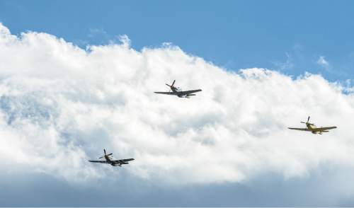 Francisco Kjolseth | The Salt Lake Tribune
Brig. Gen. Roland Wright, who piloted the "Mormon Mustang" in World War II, is laid to rest at Wasatch Lawn Memorial Park in Salt Lake City on Monday, Oct. 26, 2015. Three P-51s, including a replica of his plane, along with a Utah Air National Guard tanker aircraft fly over the cemetery in Wright's honor.