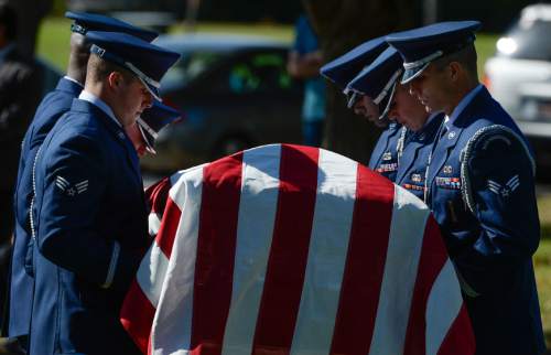 Francisco Kjolseth | The Salt Lake Tribune
Brig. Gen. Roland Wright, who piloted the "Mormon Mustang" in World War II, is laid to rest at Wasatch Lawn Memorial Park in Salt Lake City on Monday, Oct. 26, 2015. Three P-51s, including a replica of his plane, along with a Utah Air National Guard tanker aircraft fly over the cemetery in Wright's honor.