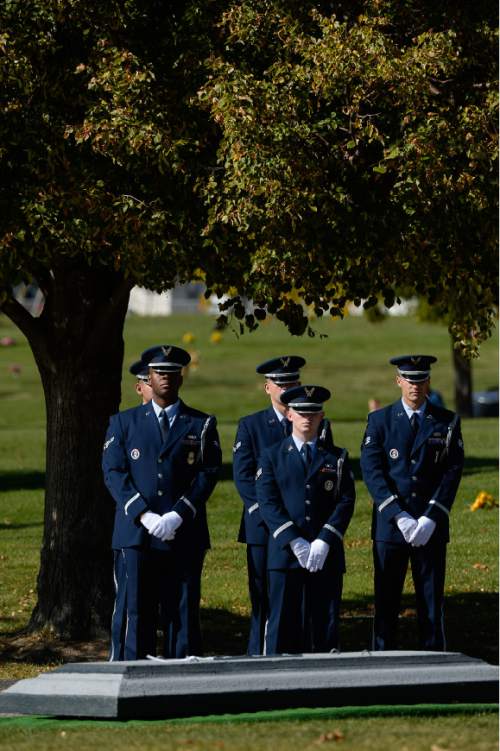 Francisco Kjolseth | The Salt Lake Tribune
Air National Guardsmen stand at attention as Brig. Gen. Roland Wright, who piloted the "Mormon Mustang" in World War II, is laid to rest at Wasatch Lawn Memorial Park in Salt Lake City on Monday, Oct. 26, 2015. Three P-51s, including a replica of his plane created in his honor along with a Utah Air National Guard tanker aircraft flew over the cemetery.