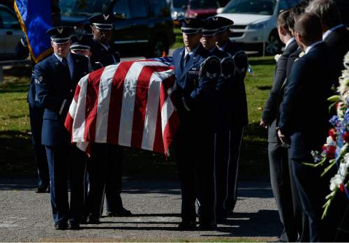 Francisco Kjolseth | The Salt Lake Tribune
Brig. Gen. Roland Wright, who piloted the "Mormon Mustang" in World War II, is laid to rest at Wasatch Lawn Memorial Park in Salt Lake City on Monday, Oct. 26, 2015. Three P-51s, including a replica of his plane, along with a Utah Air National Guard tanker aircraft fly over the cemetery in Wright's honor.