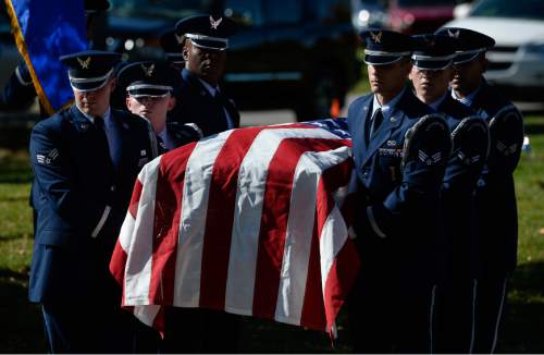 Francisco Kjolseth | The Salt Lake Tribune
Brig. Gen. Roland Wright, who piloted the "Mormon Mustang" in World War II, is laid to rest at Wasatch Lawn Memorial Park in Salt Lake City on Monday, Oct. 26, 2015. Three P-51s, including a replica of his plane, along with a Utah Air National Guard tanker aircraft fly over the cemetery in Wright's honor.