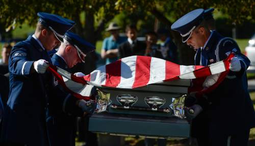 Francisco Kjolseth | The Salt Lake Tribune
Brig. Gen. Roland Wright, who piloted the "Mormon Mustang" in World War II, is laid to rest at Wasatch Lawn Memorial Park in Salt Lake City on Monday, Oct. 26, 2015. Three P-51s, including a replica of his plane, along with a Utah Air National Guard tanker aircraft fly over the cemetery in Wright's honor.
