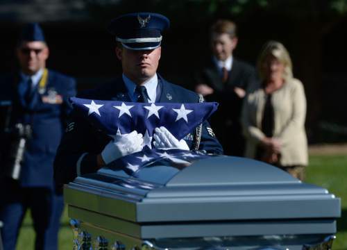 Francisco Kjolseth | The Salt Lake Tribune
Brig. Gen. Roland Wright, who piloted the "Mormon Mustang" in World War II, is laid to rest at Wasatch Lawn Memorial Park in Salt Lake City on Monday, Oct. 26, 2015. Three P-51s, including a replica of his plane, along with a Utah Air National Guard tanker aircraft fly over the cemetery in Wright's honor.