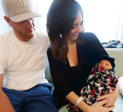 Steve Griffin  |  The Salt Lake Tribune


Three-day-old Bayne Marsh peeks up at her parents, Korey and Makenzie Marsh, of Herriman, at the Women's and Newborn Center at the Intermountain Medical Center in Murray, Tuesday, July 7, 2015.