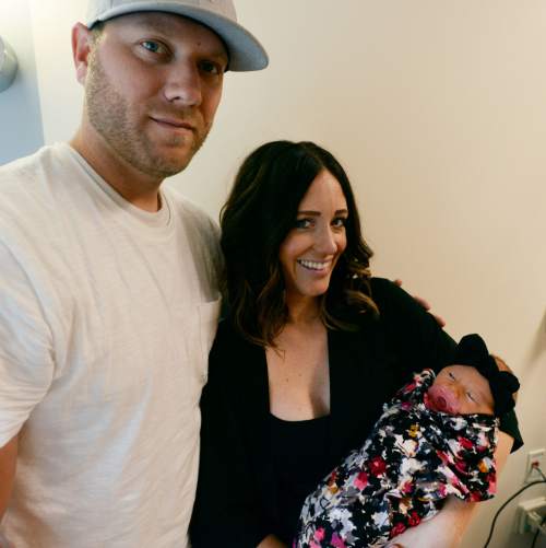 Steve Griffin  |  The Salt Lake Tribune


Korey and Makenzie Marsh, of Herriman, with their three-day old daughter, Bayne, at the Women's and Newborn Center at the Intermountain Medical Center in Murray, Tuesday, July 7, 2015.
