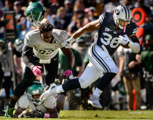 Trent Nelson  |  The Salt Lake Tribune
Brigham Young Cougars running back Francis Bernard (36) runs away from Wagner Seahawks linebacker Stephon Font-Toomer (33) as BYU hosts Wagner, NCAA football at LaVell Edwards Stadium in Provo, Saturday October 24, 2015.
