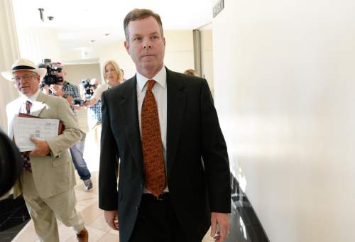 Francisco Kjolseth | The Salt Lake Tribune
Former Utah Attorney General John Swallow, right, exits the Matheson Courthouse in Salt Lake City on Monday, July, 27, 2015, alongside his attorney Steve McCaughey. Swallow who appeared for an arraignment hearing had his attorney plead not guilty on his behalf to more than a dozen criminal charges of corruption.