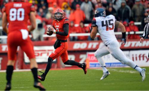 Chris Detrick  |  The Salt Lake Tribune
Utah Utes quarterback Travis Wilson (7) runs past Arizona Wildcats linebacker Derrick Turituri (45) during the game at Rice-Eccles Stadium Saturday November 22, 2014.