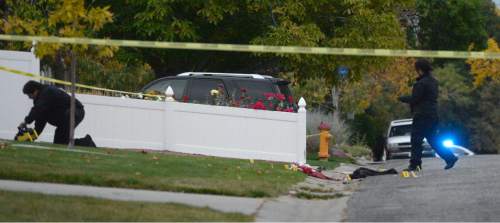 Al Hartmann  |  The Salt Lake Tribune
Scene of early morning double shooting-homicide Thursday Oct. 29 between a homeowner and assailant in Millcreek area of Salt Lake County.  Unified Police Dept. investigate the crime scene where the bodies fell.