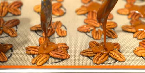 Leah Hogsten  |  The Salt Lake Tribune
Caramel pecan turtles are drizzled in caramel and then topped in melted milk chocolate. The sweet and salty flavor of salted caramel can be found in cookies, cakes, coffee and gelato. Chef Page Ane Viehweg directs Sur la Table students on the intricacies of making smooth, creamy caramel from scratch, Thursday, Oct. 22, 2015.